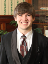 Ira Sickles in a suit and tie